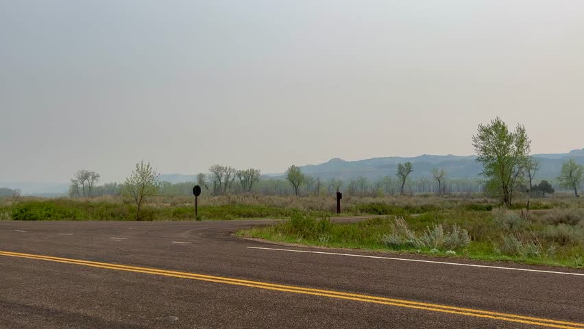 Panning Left on the badlands hills and mountains in the Cannonballs area in the North Unit in  Theodore Roosevelt National Park in North Dakota.