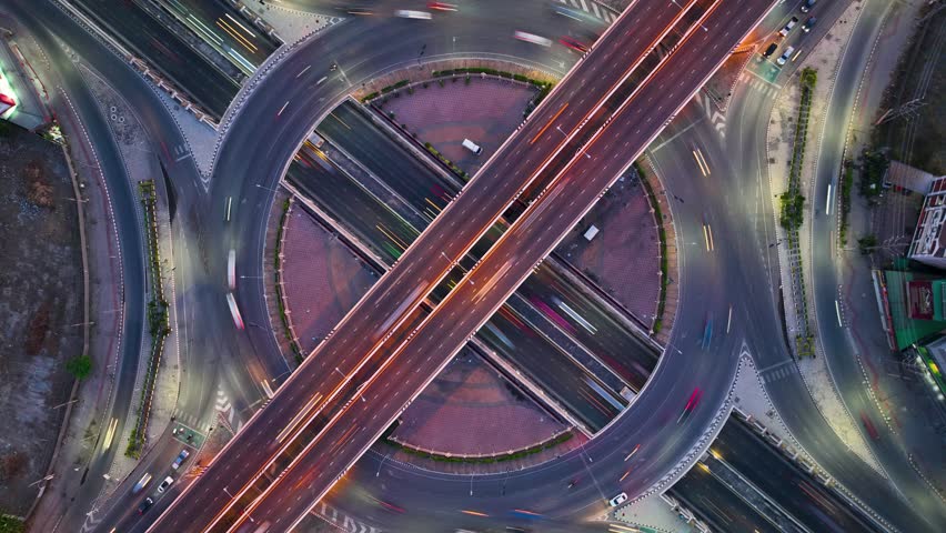 Hyperlapse time-lapse of Expressway top view, Road traffic an important infrastructure, car traffic transportation above intersection road in city night of advanced innovation, financial technology Royalty-Free Stock Footage #1106498797