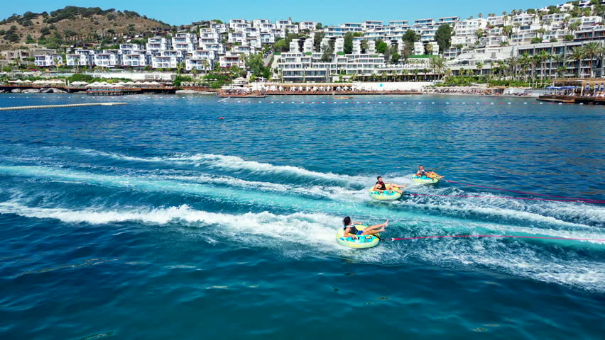 Aerial shot of ringo water sports in the sea.