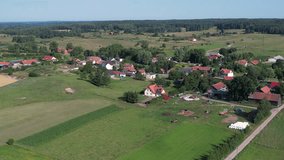 Aerial View Village Countryside Landscape. Suburban Area With Residential Buildings Poland. Farmhouses Into Green Land Poland. Aerial View Farmhouse, Hills Fields Trees Forest Agriculture Field. - Powered by Shutterstock - Get 15% off with code: PIKWIZARD15