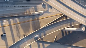 Vertical Aerial Video: Road junction. Drone footage of top view of Highway road junctions. The Intersecting freeway road overpass. Overhead Shot of Judge Pregerson Highway showing multiple Roads. 