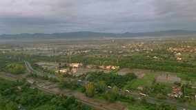 aerial view Rural Punjab, Village, Sunset, Sunrise, Glowing Sun after rain, nature, Hills, Tharmal Plant, sky, water, highway, house, tree, trafic, cinematic, drone footage, beautiful, Ready to use.