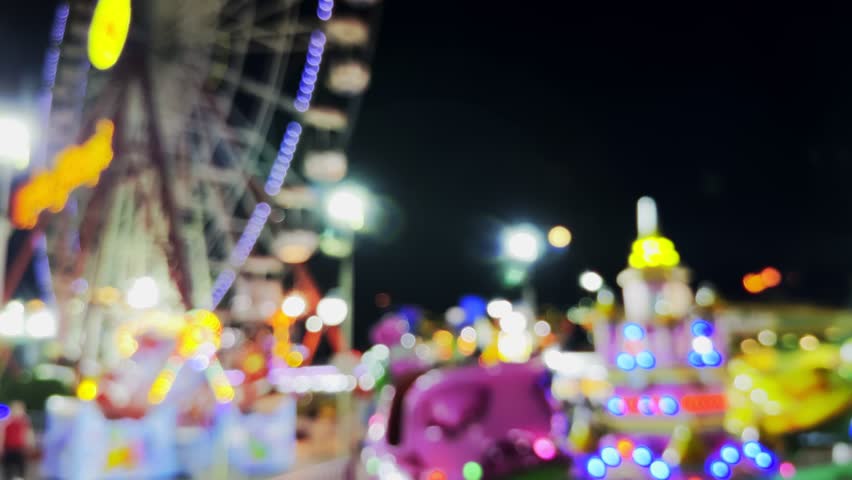 Blurry Amusement Park Happy Times Place at Night