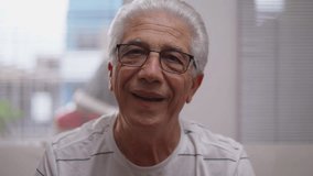 Headshot portrait of Elderly man nodding yes to camera smiling. affirming conversation, close-up face of senior person listening attentively - Powered by Shutterstock - Get 15% off with code: PIKWIZARD15