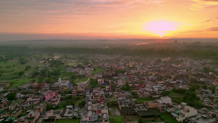 Aerial View of Rural Punjab, India, Evening, Sunset, Beautiful Drone Shot, Cinematic Video, Raw Footage, Viallge, House, Nature, Factory, Sikh Temple, Sky, Cloud, Sun.  Royalty-Free Stock Footage #1106518961
