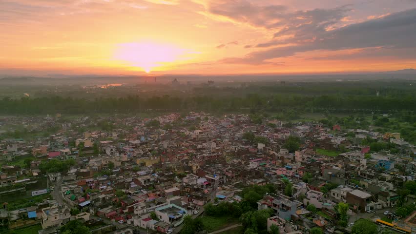 Aerial View of Rural Punjab, India, Evening, Sunset, Beautiful Drone Shot, Cinematic Video, Raw Footage, Viallge, House, Nature, Factory, Sikh Temple, Sky, Cloud, Sun.  Royalty-Free Stock Footage #1106518963