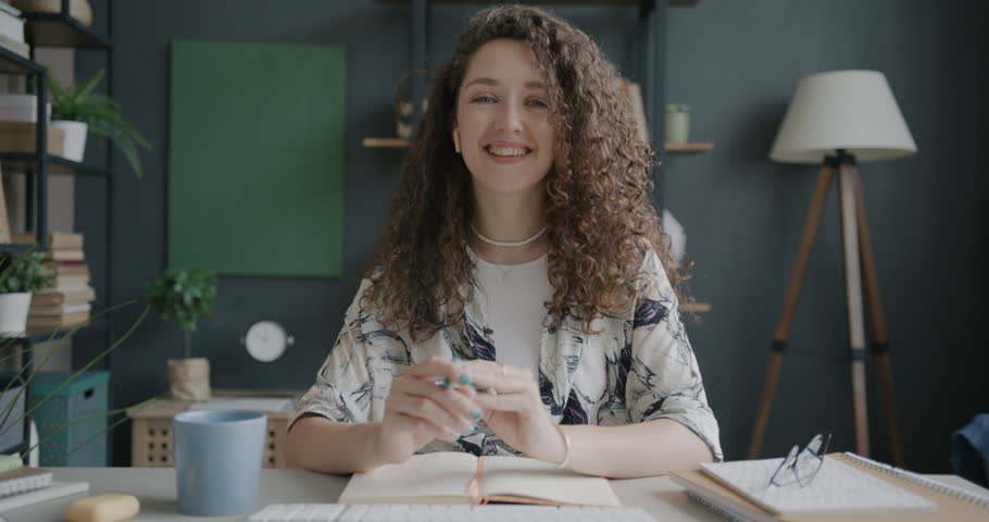 Portrait of successful business lady making online video call speaking discussing work in office. Modern technology and communication concept.