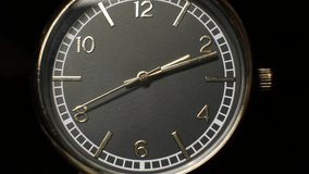 Mechanical watch close-up. Accelerated clock video. arrows move quickly. dark background. Time . The concept of quickly passing time.