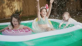  Group of Little Girls of Various Ages Play and Have Fun in a Pool - Powered by Shutterstock - Get 15% off with code: PIKWIZARD15