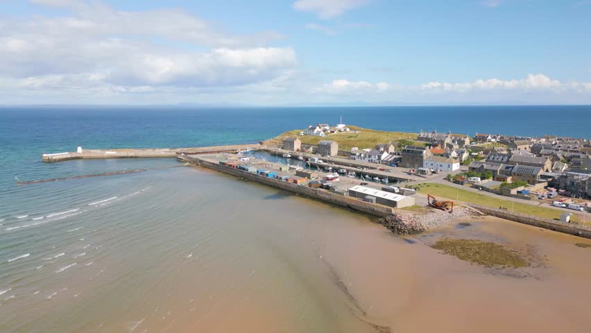 This is an aerial drone shot of Burghead. a small harbourtown in Moray, Scotland. 