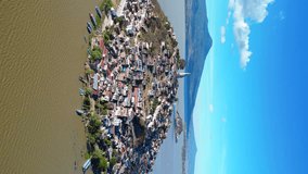 Approaching Janitzio Island: Vertical Aerial Video Showcasing the Magnificent Landmark in Lake Patzcuaro