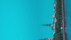 Riga, Latvia, Europe. Hyperlapse Cityscape Skyline In Evening Time. Vertical Footage Video Of Popular Place. Night View Of Castle, Dome Cathedral And St. Peter's Church. Unesco World Heritage Site.