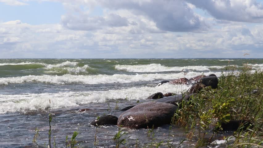Hindens rev at Vänern. The biggest lake in Sweden. Large wet rocks. Windy outside this summer day. Near Lidköping.