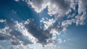 futuristic background consisting of Time lapse clip of white fluffy clouds over blue sky and their reflection, video loop