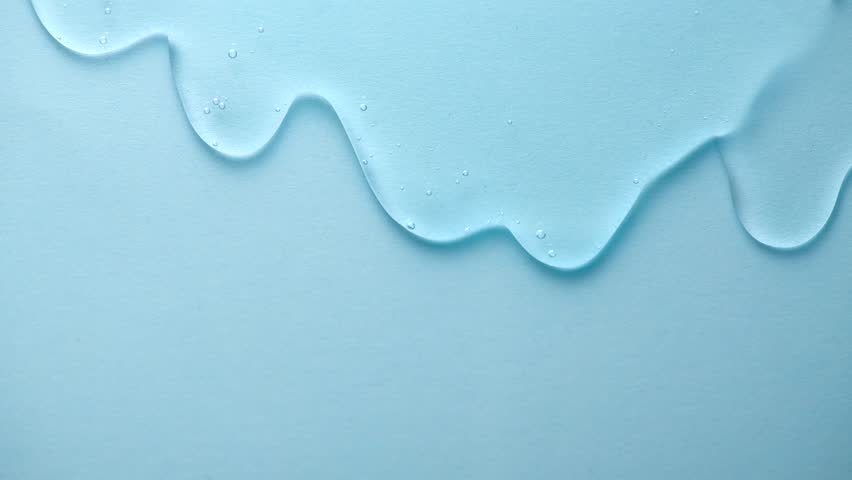 Cosmetics serum fluid gel flowing over blue background, dripping hyaluronic acid cream texture, facial treatment, Cream gel transparent cosmetic serum oil texture backdrop, hydrating, moisturizing