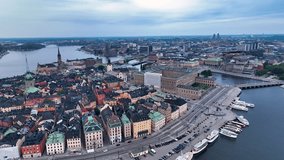 Aerial view of Stockholm old town and city center. Flying over the bay. Amazing drone footage of Stockholm yacht canal at a beautiful morning.