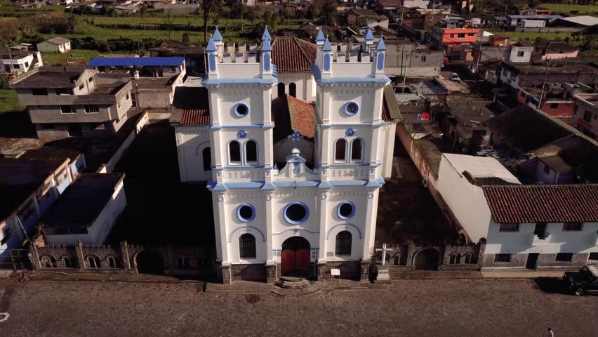 4k drone shot of the Tucuso church in the city of Machachi, Pichincha, Ecuador, on a sunny day.