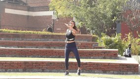 Video of slim girl performing full body weight loss exercise.
