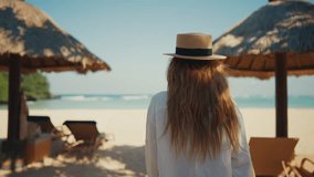 Romantic blonde woman tourist in straw hat walking to ocean sandy beach in sunny day, rear view. Female lady enjoying nature on vacations summer holidays. Travel, tourism, journey, rest relax concept. - Powered by Shutterstock - Get 15% off with code: PIKWIZARD15