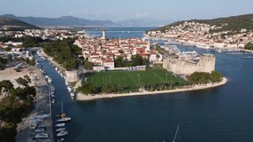Capture a unique blend of ancient architecture and modern life in Trogir, Croatia with this 4K drone video. Ideal for projects on culture, history, and sports.