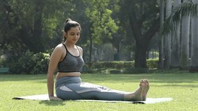 Video clip of an Indian woman doing the reverse plank or upward plank pose exercise.
