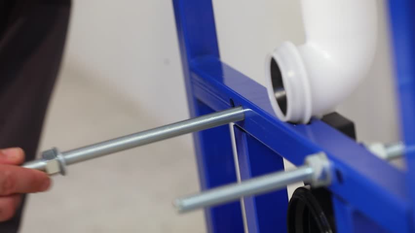 the master placing the bolt to tighten