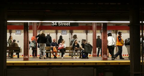 NEW YORK CITY - MAY 13, 2015: Train arriving in 34 st. subway station. The NYC Subway is one of the oldest and most extensive public transportation systems in the world, with 468 stations. 