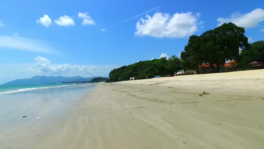 paradise beach of white sand with the island of langkawi malaysia