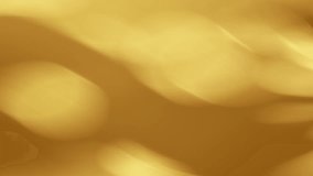 A golden background with patterns of circles, wavy lines, light spots, and a textured surface, highlighting gold color - Powered by Shutterstock - Get 15% off with code: PIKWIZARD15