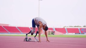 Asian athletes are disabled with prosthetic blades running at stadium. Attractive amputee male runner exercise and practicing workout for Paralympics competition regardless of physical limitations. - Powered by Shutterstock - Get 15% off with code: PIKWIZARD15
