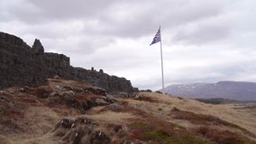 Iceland Flag in full motion by Wind during Late Spring in Thingvellir National Park, Iceland.