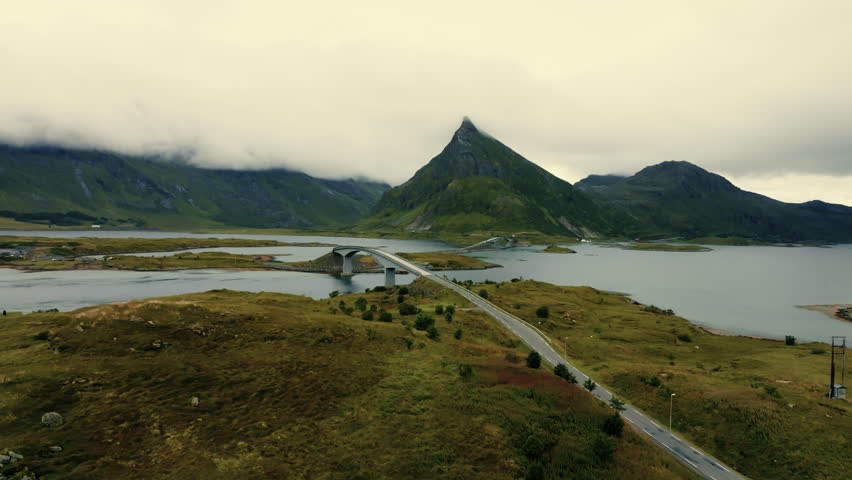 Beautiful panoramic view of a driveway and bridge in an epic scandinavian landscape
