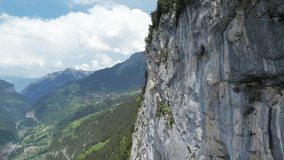 Aerial Drone Video Moving Forward Revealing a Town within the Swiss Alps Near Interlaken and Lauterbrunnen 