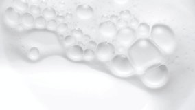 Foam bubbles background. Moving Soap foam popping bubble, white backdrop. Soap sud macro structure. Soap foam close-up. Clean, cleaning concept, laundry, shower. Slow motion.  - Powered by Shutterstock - Get 15% off with code: PIKWIZARD15
