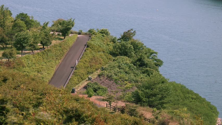 View looking down on the park by the lake. Taken at Miyagase Dam.