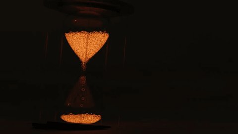 Glowing hourglass flows in the desert. 3d animation Adlı Stok Video
