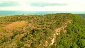 Aerial video and aerial photography of a mountain with a high cliff There is a plain below. in Chaiyaphum Province, Thailand