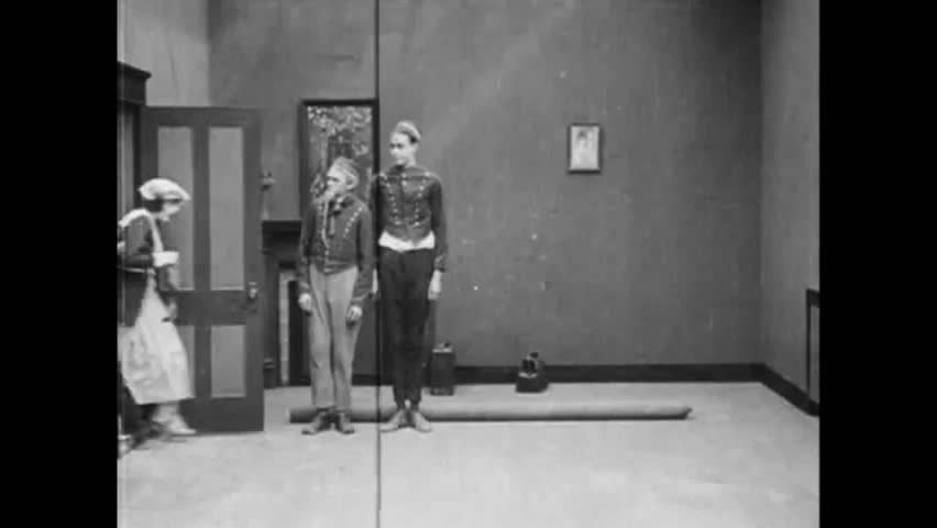 Circa 1918 - in this silent comedy, a concierge (harold lloyd) shows guests how the furniture in their room can be summoned with the push of a button.