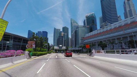 SINGAPORE - CIRCA APRIL 2015: POV, driving on freeway towards business district Raffles place, Singapore.