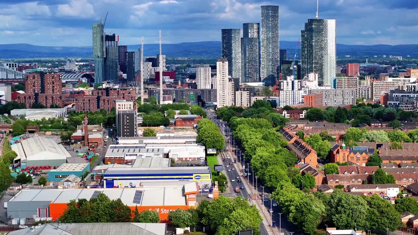 Manchester Skyline aerial videos showing new high-rises with a cloudy sky on the background. 