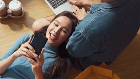happiness asian lover couple lying on your lap postive conversation taking a break between home relocation home moving in to new house happiness casual house renovation, asian couple lying on floor  - Powered by Shutterstock - Get 15% off with code: PIKWIZARD15