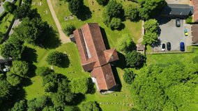 A bird's-eye-view roll-shot of St Lawrence the Martyr church in Godmersham.