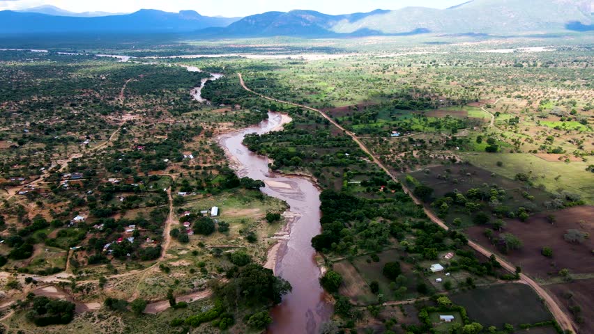 River scape-drone view. Drone view of river flowing in a small village of Africa town Loitokitok Kenya Africa. drone fly, Africa Kenya, Nairobi, Amboseli Kenya.
