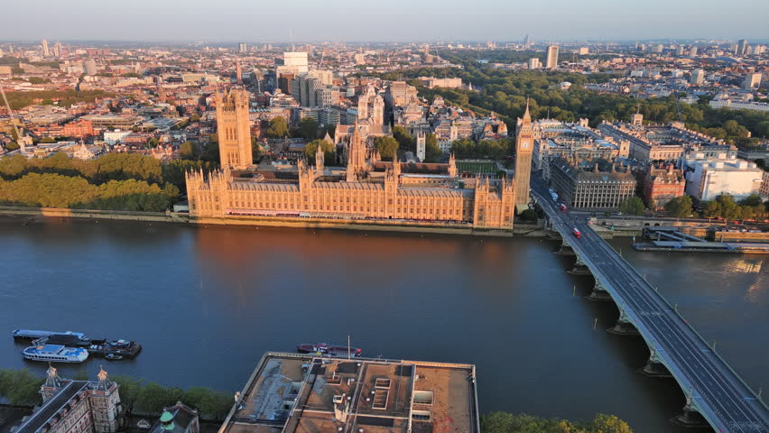 Aerial View of London, UK: Iconic Clock Tower, Big Ben and Palace of Westminster in Center of Capital City of Great Britain and Northern Ireland at Sunrise Royalty-Free Stock Footage #1106629705