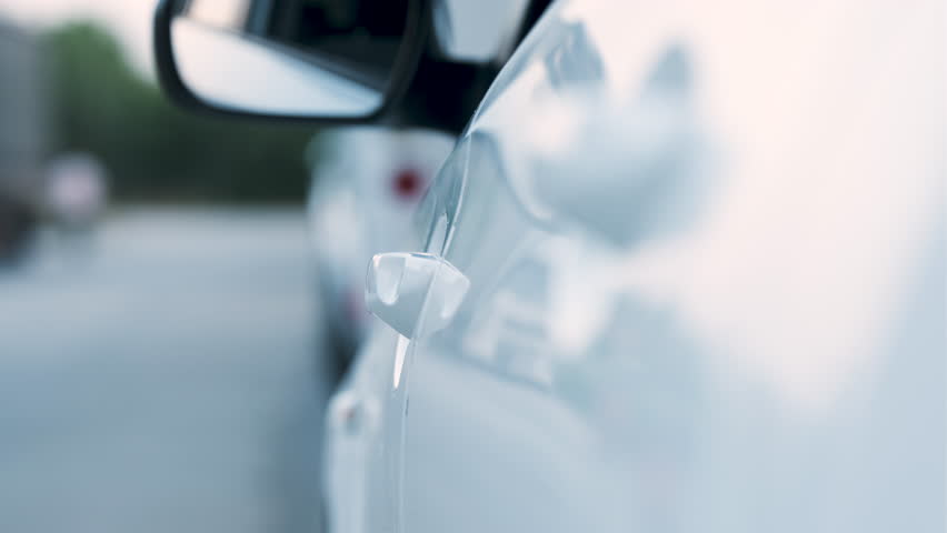 Beautiful Woman Get In The White Car And Sitting to Front Seat of Car. Opening Vehicle's Door to Drive and Go. Detail Shot of Door Handle Real Time on Evening. Royalty-Free Stock Footage #1106631343