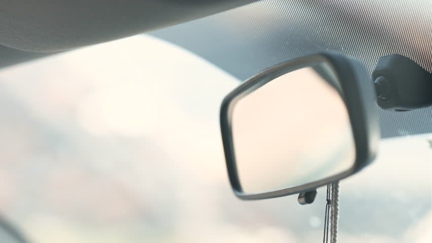 Woman Fixing Rear-View Mirror To See Back Road Before Drive Car. Driver Adjusting Mirror Manually in Car.  Royalty-Free Stock Footage #1106632579