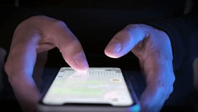 Close up, young man use of mobile phone, fast shooting at night, male hands typing and messaging chat smartphone. Modern wireless tech user concept. - Powered by Shutterstock - Get 15% off with code: PIKWIZARD15