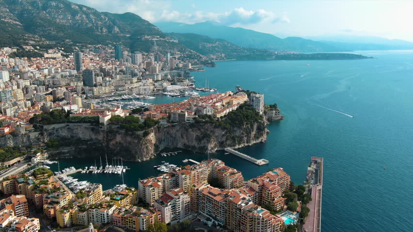 Monte Carlo, Monaco City aerial panoramic view with Prince's Palace, Saint Nicholas Cathedral and Museum of Oceanography around Port de Fontvieille in French Riviera near France in Europe 4K UHD Royalty-Free Stock Footage #1106643061