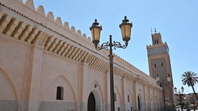 Video about the streets of Marrakesh with a mosque in the background, Morocco