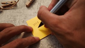 Man writing "Will Be Back Soon " note on a yellow paper note with black pen and soft focus scene. - Powered by Shutterstock - Get 15% off with code: PIKWIZARD15